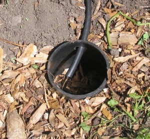 1/2 inch tubing releases GW into mulch shiled